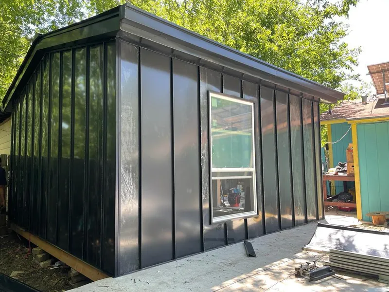 Black standing seam metal wall panels for Roof Inspection in West Mifflin